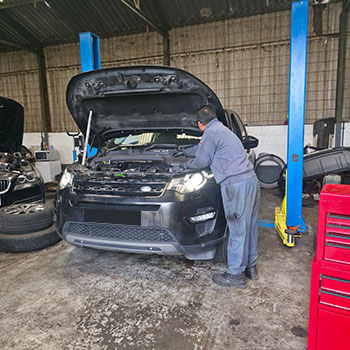 Land Rover engine repair and replacement in workshop
