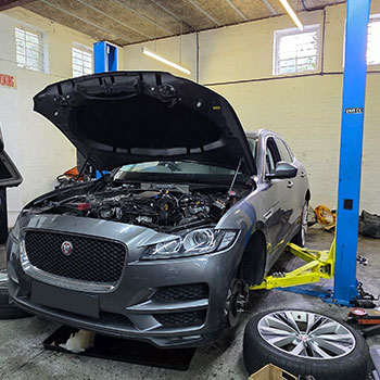 Jaguar engine bay inspection before replacement engine installation