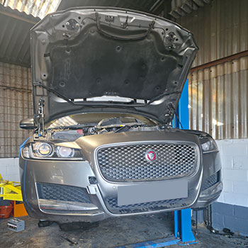 Range Rover engine lifted for replacement installation