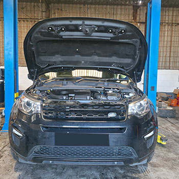 Range Rover engine removal using workshop crane