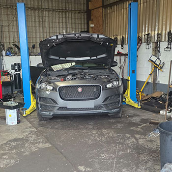 Jaguar F-Pace engine replacement on vehicle lift